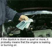 checking oil level on dipstick