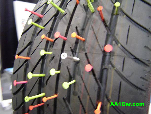 run-flat tire with nails and screws